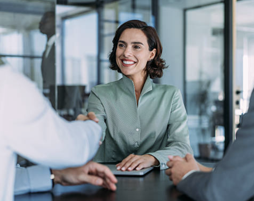 Funding advisor shaking hands with a business owner